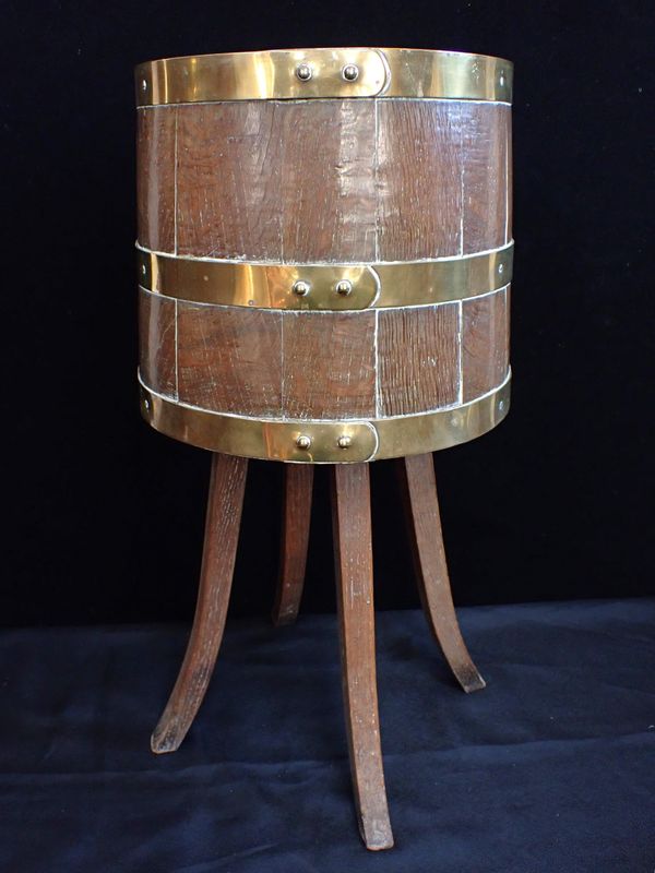 A BRASS-BOUND OAK JARDINIERE