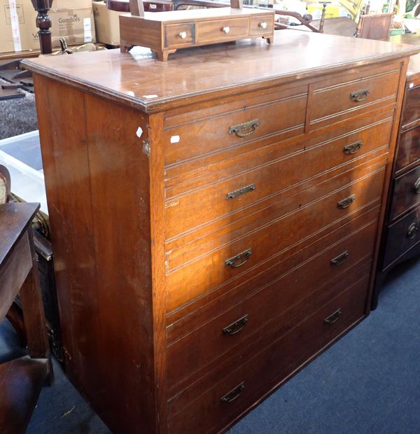 A LATE VICTORIAN OAK CHEST OF DRAWERS