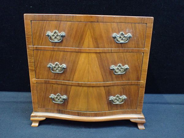 A FIGURED WALNUT MINIATURE CHEST OF DRAWERS BY H. UPHILL, WILTON