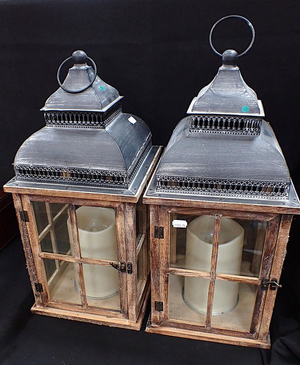 A PAIR OF DECORATIVE WOOD AND METAL LANTERNS