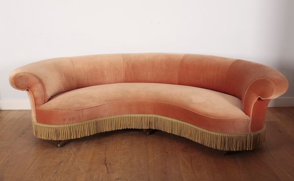 AN EDWARDIAN CRESCENT-SHAPED SOFA