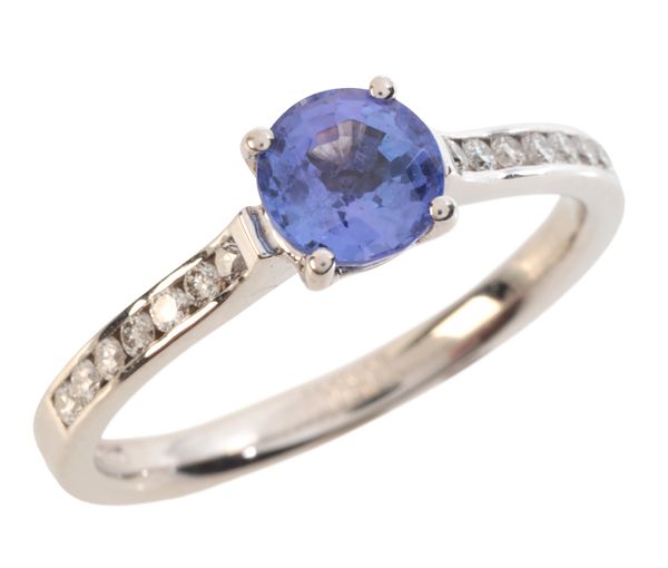 A TANZANITE AND DIAMOND RING