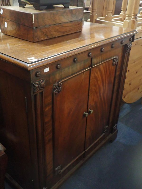 A WILLIAM IV MAHOGANY CABINET, WITH CARVED DECORATION