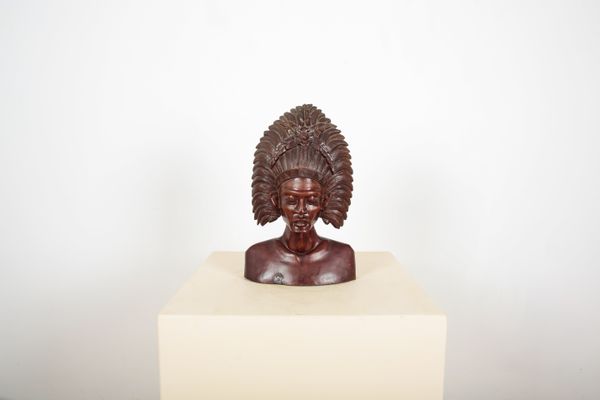 A HARDWOOD INDONESIAN CARVED BUST
