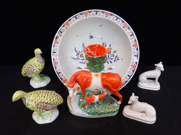 A VICTORIAN STAFFORDSHIRE COW AND CALF SPILL VASE