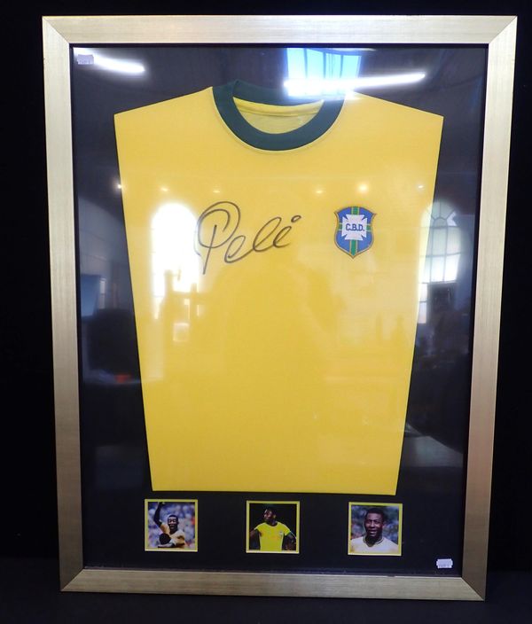 A FRAMED SIGNED PELE SHIRT