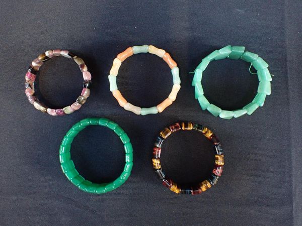 A COLLECTION OF GEM-SET BRACELETS