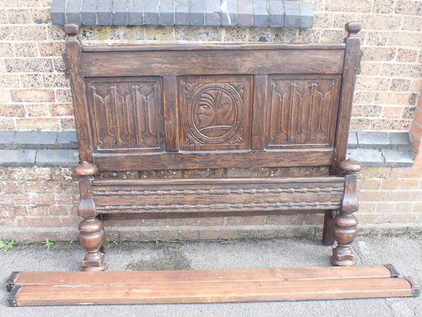 A JACOBEAN STYLE OAK DOUBLE BED