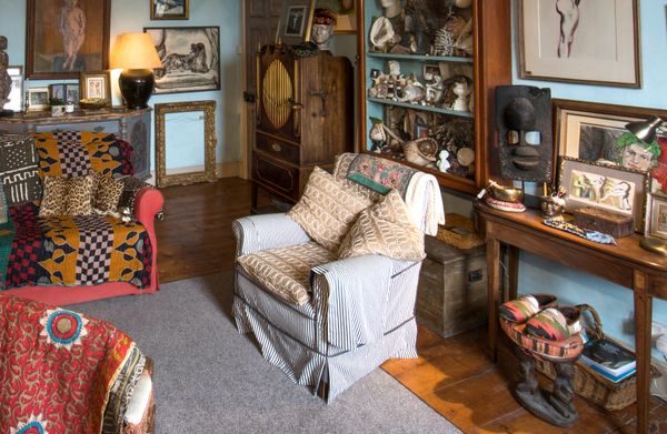 AN UPHOLSTERED EDWARDIAN ARMCHAIR