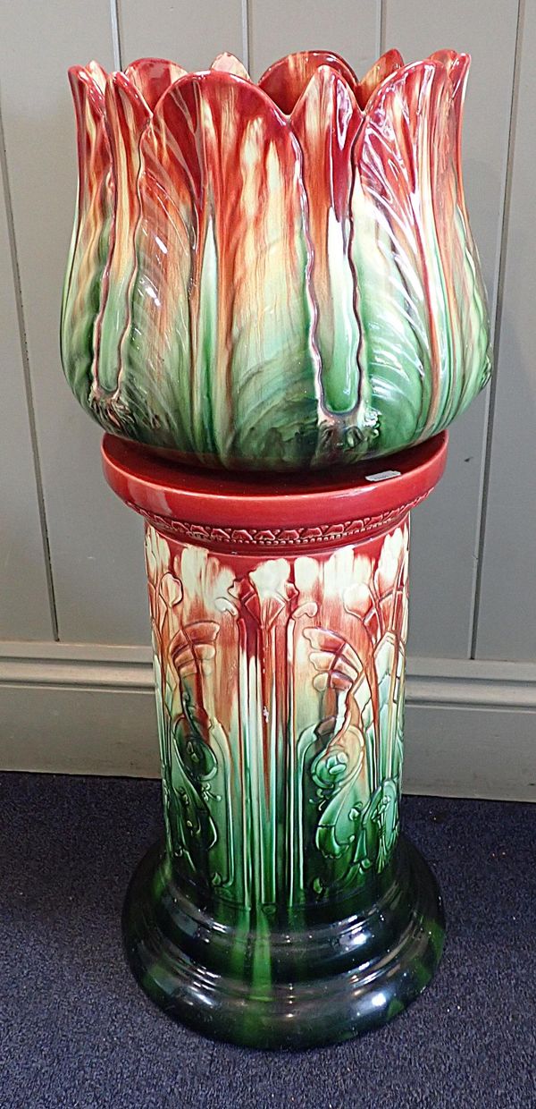 A LATE VICTORIAN MAJOLICA JARDINERE AND STAND