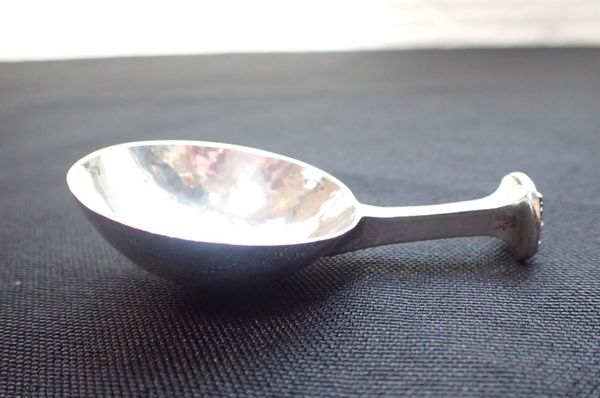 AN A. E. JONES SILVER CADDY SPOON