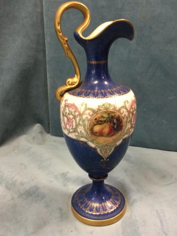 A Royal Worcester ewer with acanthus scrolled burnished gilt handle
