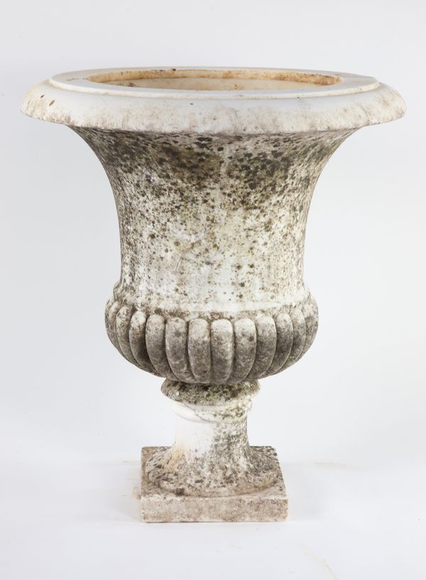 A carved white marble urn