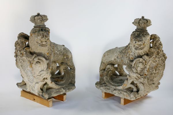 A pair of rare and important carved limestone heraldic gate pier lions