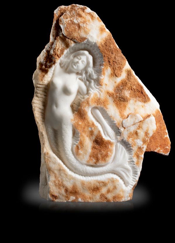 A specimen of quartzite with relief carved mermaid