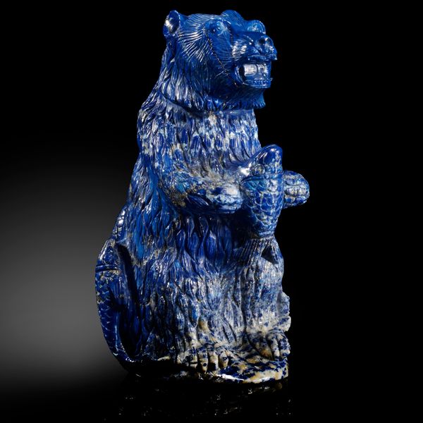 A carved Lapis lazuli bear holding a salmon in fitted box 17cm high
