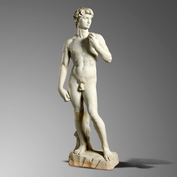 An over-life size carved white marble figure of David after Michelangelo Italian, mid 20th century  220cm high  The original Renaissance sculpture...