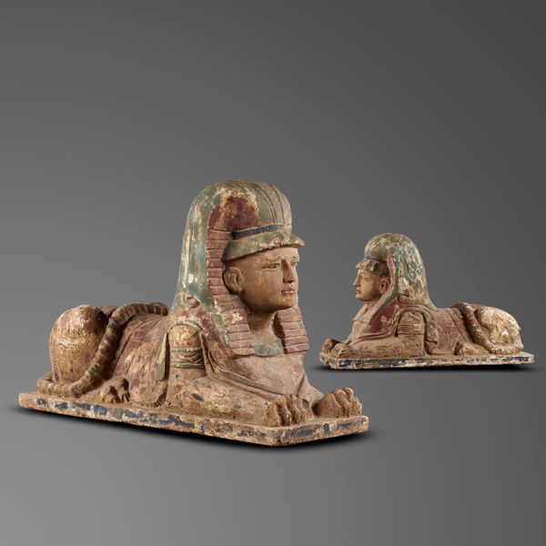 A pair of rare polychrome painted wood sphinxes 1920‘s 84cm high by 120cm long This unusual pair of painted wood sphinxes were most probably made in...