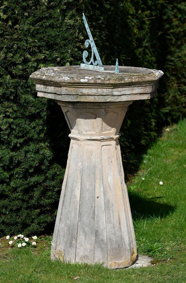 ‡ A substantial carved sandstone sundial French, late 18th/early 19th century the octagonal top with bronze gnomen and points of the compass obelisk 