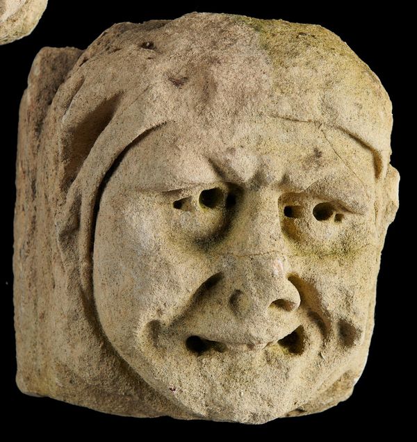 A late medieval carved limestone architectural head English or French, 15th century 24cm high by 25cm wide