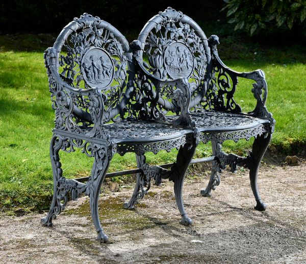 ‡ A rare Lion Foundry cast iron Seasons seat late 19th century with panels representing Summer and Autumn, the back fully stamped registered by W...