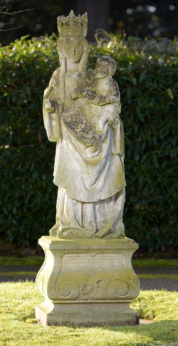 A Caen stone figure of the Virgin and Christ child  133cm on later limestone pedestal, 180cm overall Provenance: The Countess of Midleton, Eastwell...