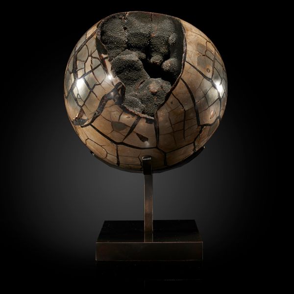A large septarian sphere on bronze stand 38cm high overall