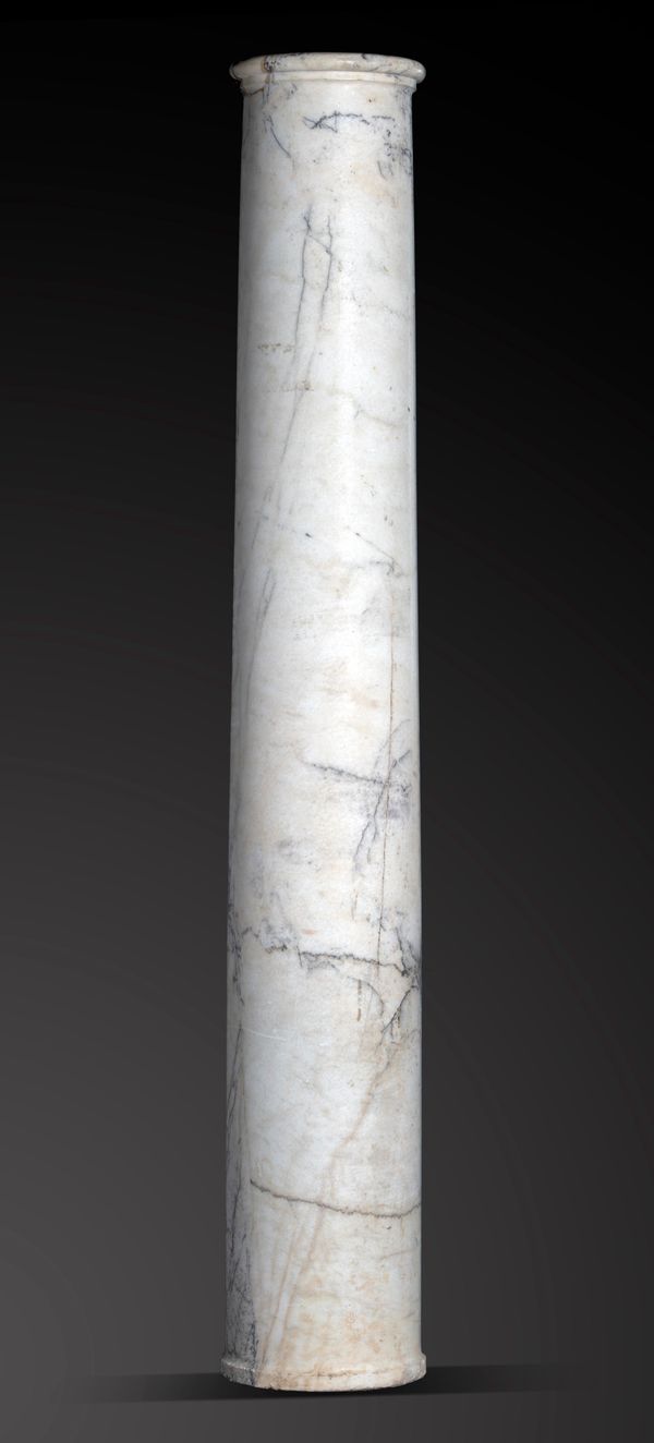 A Breccia marble column  probably Roman, 1st-3rd Century AD 260cm high by 46cm diameter, now with iron base plate Provenance: The Robin Symes...