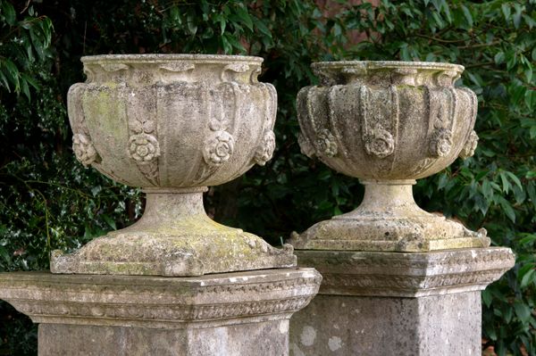 A pair of Victorian carved stone urns late 19th century 58cm high