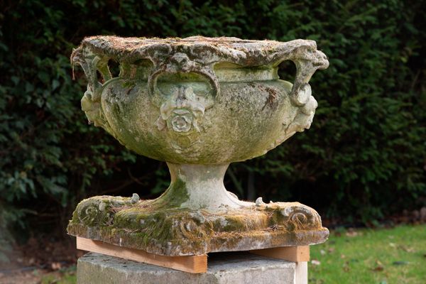 A Victorian carved stone urn late 19th century 62cm high, the base 60cm square