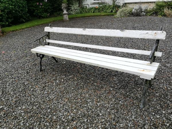 A cast iron and wooden seat late 19th century 210cm long, together with an aluminium suite of furniture Part of the Late Dr Gerald Moore Collection...