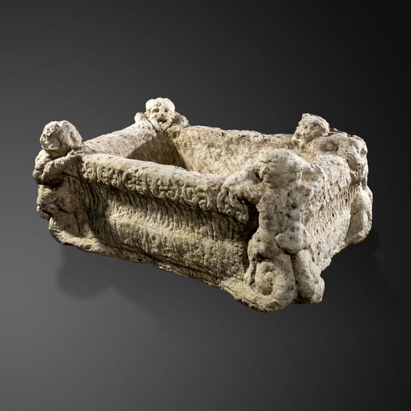 A rare carved white marble basin Italian, 16th/17th century 36cm high by 90cm long by 68cm deep Although heavily weathered, the carving on this...