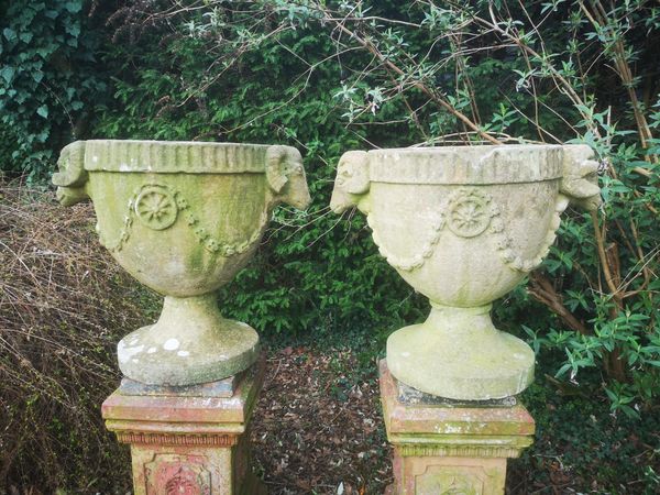 A pair of carved stone urns 19th century 66cm high   From a Private Collection in Ireland, see lot 35 for further information 
