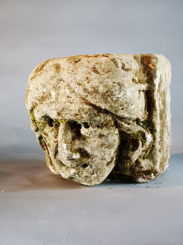 A similar carved limestone architectural head probably late medieval, English or French 15th century 24cm high by 26cm wide by 29cm deep
