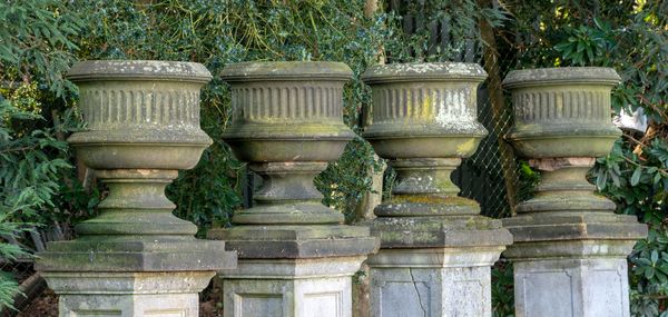 A set of four Victorian carved sandstone urns circa 1860 86cm high by 60cm diameter