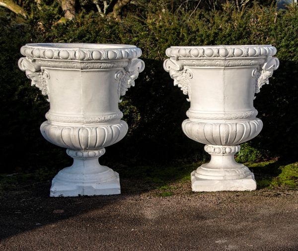 A pair of substantial composition stone urns modern 130cm high by 115cm wide The design of these urns is based on the 17th century marble vase by...