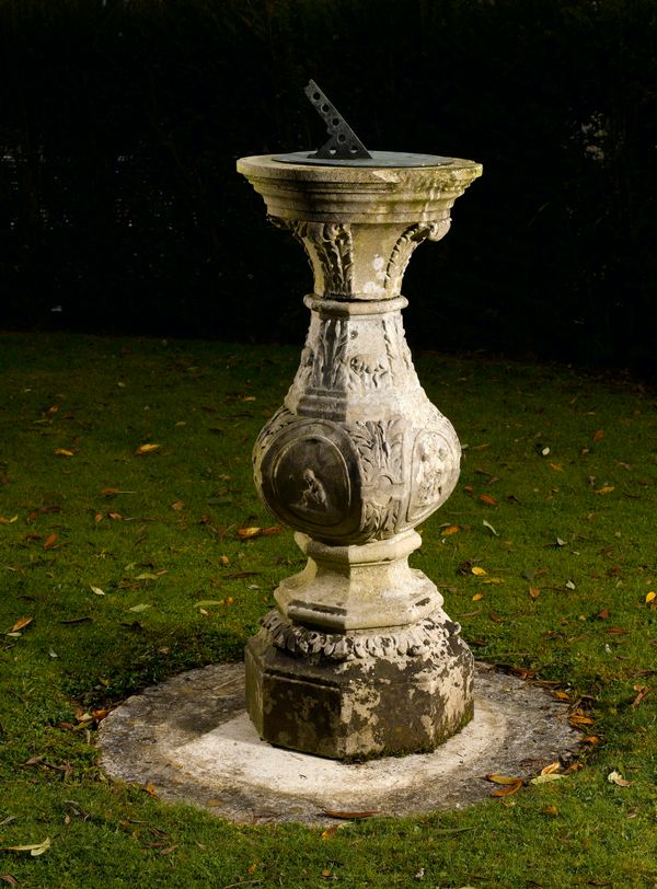 An unusual Georgian style carved Portland stone sundial early 20th century with allegorical scenes probably representing the Seasons, the circular...