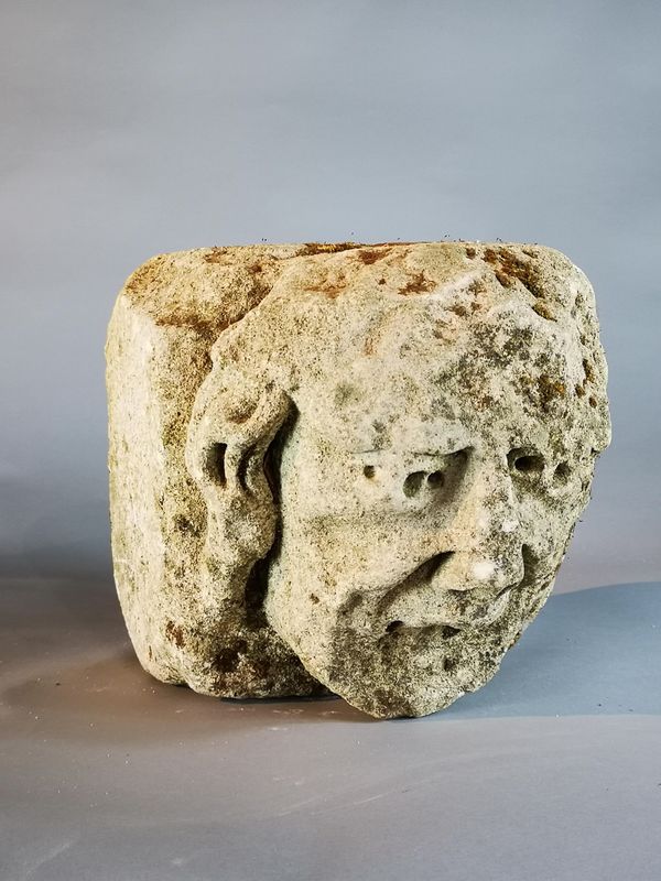 A similar carved limestone architectural head probably late medieval, English or French 15th century 24cm high by 29cm deep