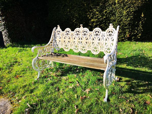 A Coalbrookdale cast iron seat 2nd half 19th century marks possibly obscured by paint 126cm wide This seat is illustrated in the 1875 Coalbrookdale...