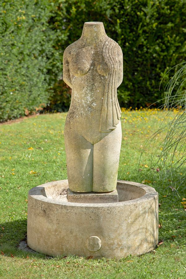 &#9650; A carved limestone bird bath by Keith Newstead  1960s with a semi draped female torso and circular base with sculptor‘s monogram 135cm high...