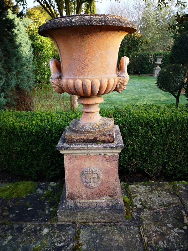 A composition stone urn on pedestal 2nd half 20th century 148cm high Provenance: From a private garden in Totteridge, North London