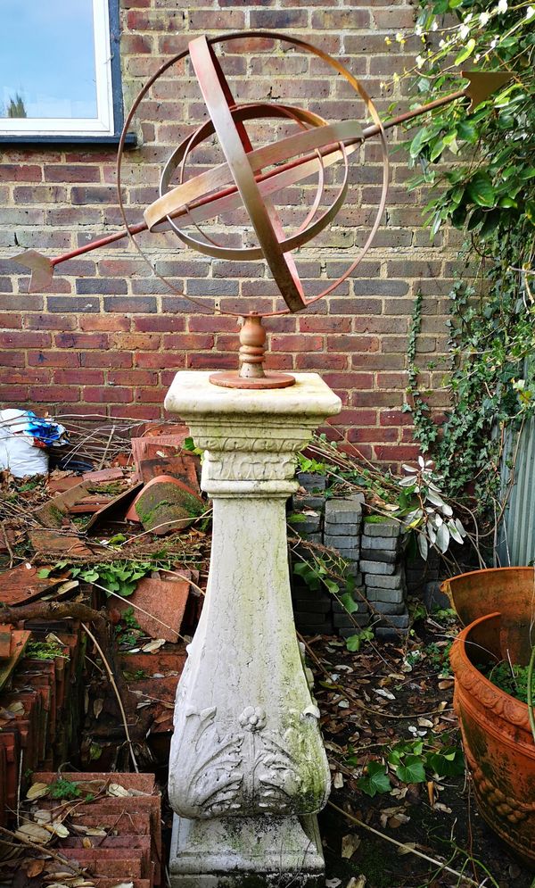 A wrought iron armillary sundial late 20th century on earlier Istrian stone pedestal, early 20th century, the pedestal 116cm high; 180cm high...