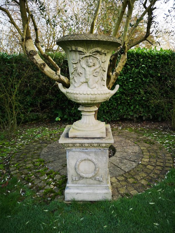 A composition stone urn on pedestal 2nd half 20th century 176cm high Provenance: From a private garden in Totteridge, North London