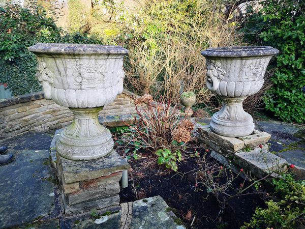 A pair of composition stone urns 2nd half 20th century 65cm high Provenance: From a private garden in Totteridge, North London