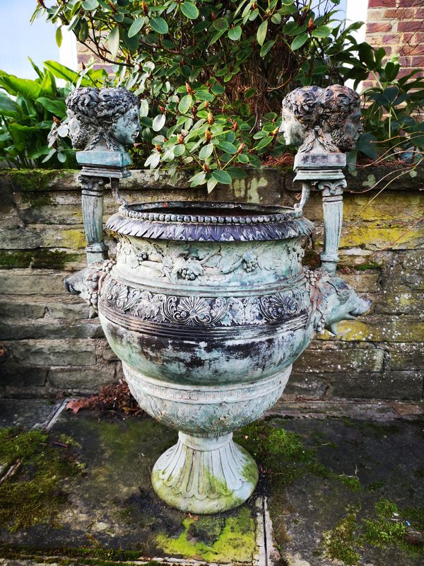 A similar pair of bronze urns Provenance: From a private garden in Totteridge, North London