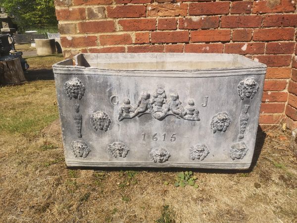 A small rare Stuart lead cistern dated 1615 and initials CJ 48cm high by 84cm wide by 42cm deep This exceptionally small cistern would appear...