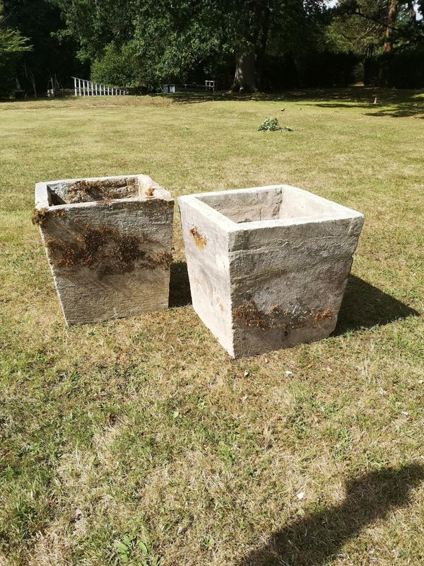 An unusual pair of carved stone square tapering planters late 19th century 61cm square