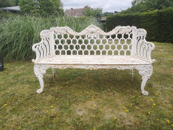 A rare Carron foundry cast iron seat late 19th century the back stamped Carron and with numerous diamond registration marks 157cm wide The design...
