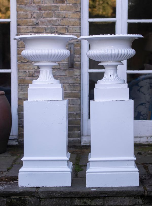 A pair of rare Coalbrookdale cast iron urns on pedestals 2nd half 19th century 122cm high overall These urns are illustrated in the 1875...