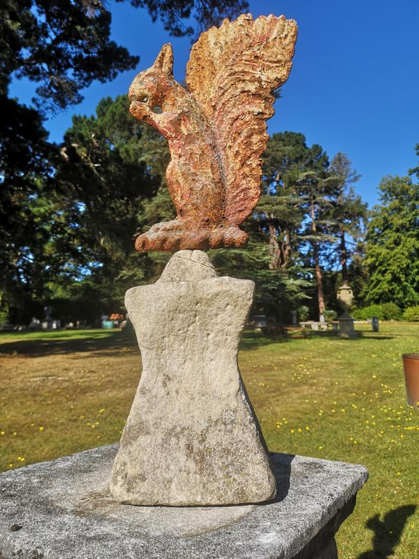 A rare cast iron armorial of a squirrel  mid 19th century on later carved stone base 75cm high overall The torse beneath the squirrel suggests that...